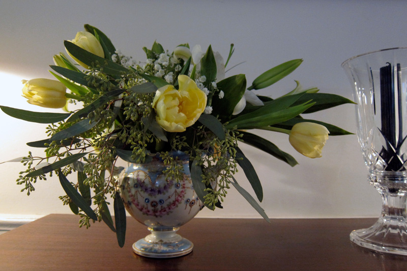 A special-occasion centerpiece with tulips and lilies