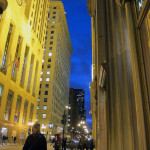 Chicago's Board of Trade at night, its towers suffused with a golden glow