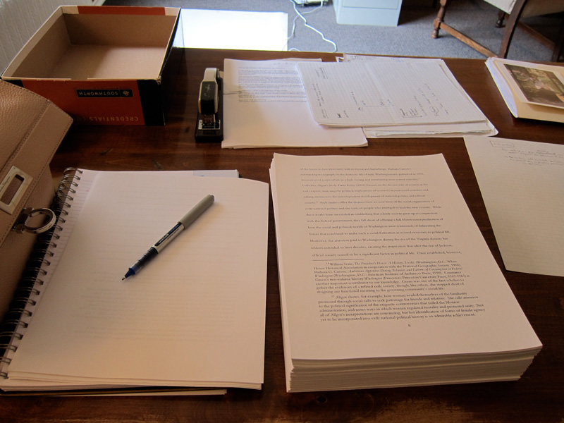 A thick manuscript on a desk