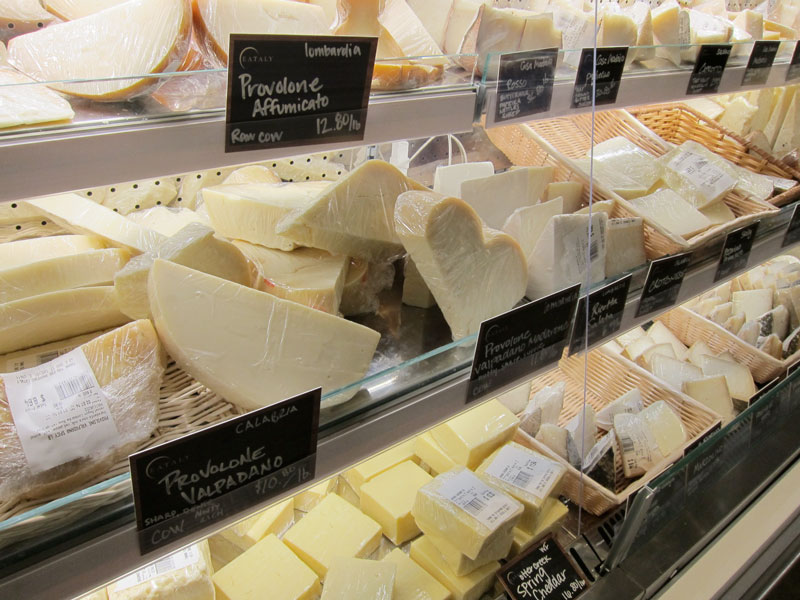 Another of the cases displaying  Italian cheeses at Eataly Chicago