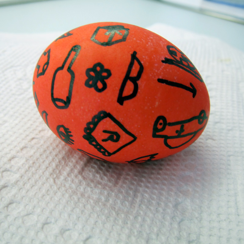 Red easter egg with sharpie line drawings
