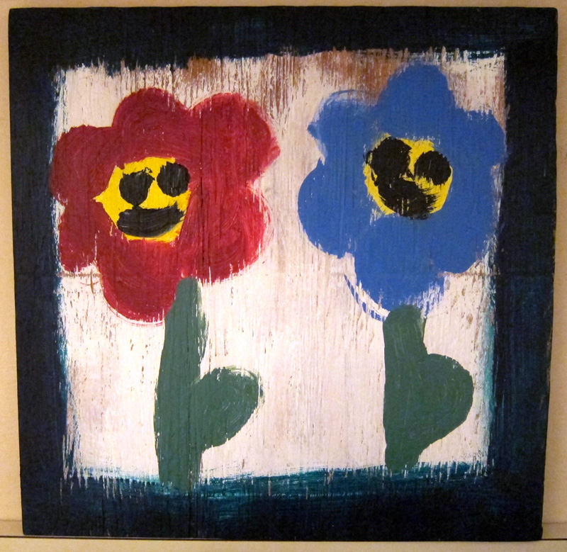 Painting of flowers with smiling faces that my niece made.