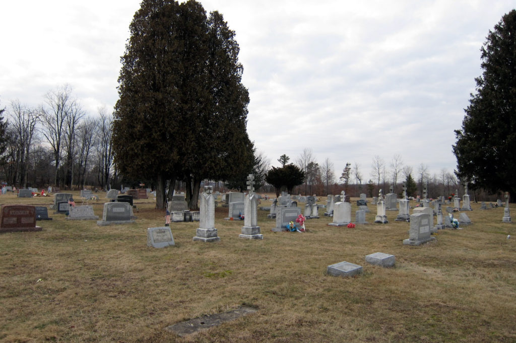 A hilltop graveyard on a winter day.