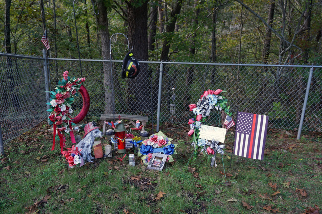 The gravesite of a firefighter, hilltop cemetery overlooking the New River